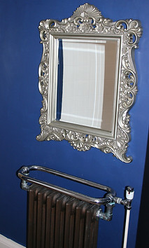 Ornate mirror and towel rail