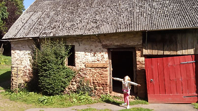 Stone barn with red door